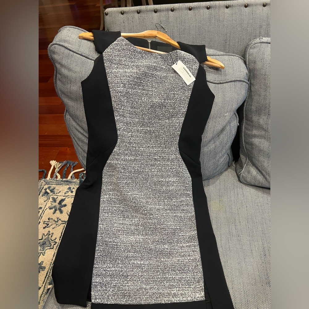 Classic tweed dress, fitting perfect for office wear or formal occasions.